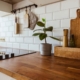 Wooden kitchen counter with cooking accessories and stovetop